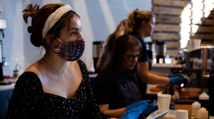 Photo of an employee using a mask to protect from COVID-19